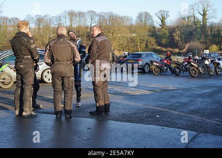 Bikers in conversation near the famous Devils Bridge, Kirkby Lonsdale, Cumbria. The location attracts many bikers esp at weekends and Bank Holidays Stock Photo