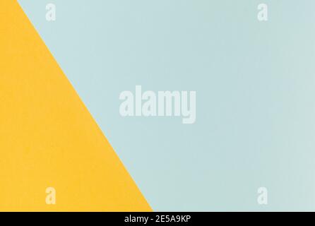 Light blue and yellow pastel color paper geometric flat lay background Stock Photo