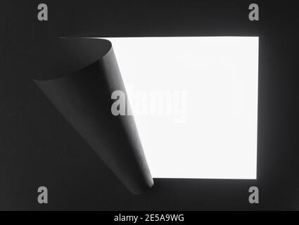 Breakthrough paper hole on isolated white background. Stock Photo