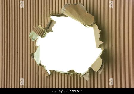 Ripped brown paper background, big hole Stock Photo
