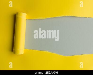 Torn yellow paper with space for text, grey background Stock Photo
