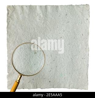 Recycled grey vintage note paper texture with  vintage magnifier on top. Stock Photo
