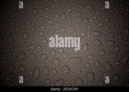 wet with water drops dark grey background with geometrical texture and gradient illumination Stock Photo