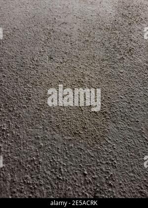 A vertical shot of a cemented wall texture Stock Photo