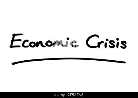 Economic Crisis, handwritten on a white background. Stock Photo
