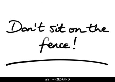 Dont sit on the fence! handwritten on a white background. Stock Photo