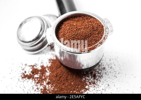 Espresso holder and replaceable coffee filters. The horn from the coffee machine on a white  Stock Photo