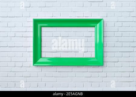 3D Rendering, white brick wall and green frame.Green blank frame hanging on white brick wall. Stock Photo