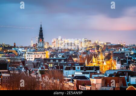 Amsterdam, Netherlands historic cityscape with the modern Zuidas district in the distance at dusk. Stock Photo