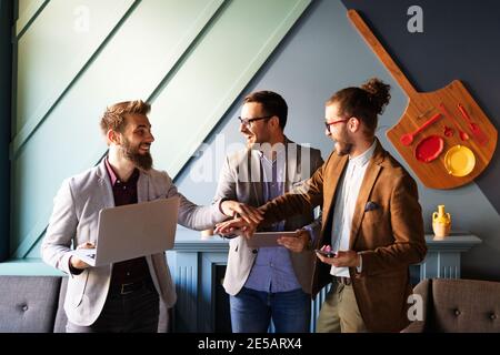 Happy successful business man giving a high fives gesture as cheer their success Stock Photo