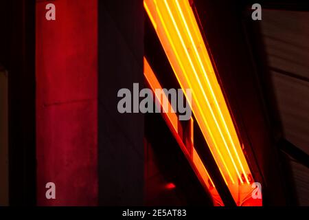 Orange strip light on a London street at night Stock Photo