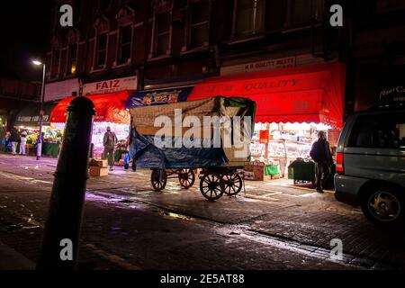 Traditional market trader's wheeled market cart at night in Brixton market at closing time, London Stock Photo