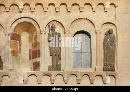 Romanesque statues of a knight and a bishop dated from the middle of the 12th century on the south facade of the Church of Saint James the Greater (Kostel svatého Jakuba Staršího) in the village of Jakub in Central Bohemia, Czech Republic. The Romanesque church consecrated in 1165 is considered to be one of the best preserved Romanesque monuments in the Czech Republic with the largest ensemble of Romanesque sculpture in the country. Stock Photo