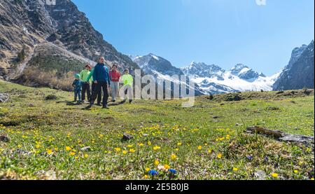 A group of hikers walking in the upper Allgäu alps near Oytal house Stock Photo