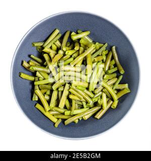 top view of portion of boiled green beans in gray bowl isolated on white background Stock Photo