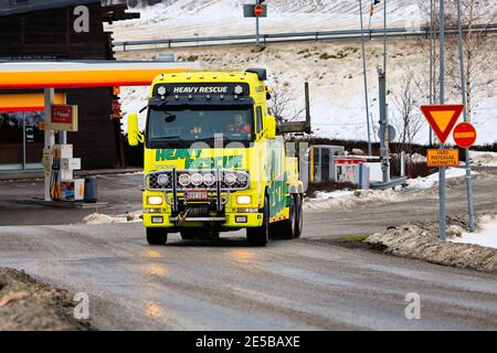 Heavy duty recovery vehicle of Heavy Rescue Europe Oy, used for towing semi trucks leaving truck stop on day of winter. Salo, Finland. Jan 23, 2021 Stock Photo