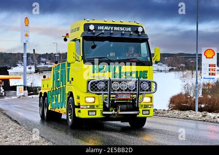 Heavy duty recovery vehicle of Heavy Rescue Europe Oy, used for towing semi trucks leaving truck stop on day of winter. Salo, Finland. Jan 23, 2021 Stock Photo