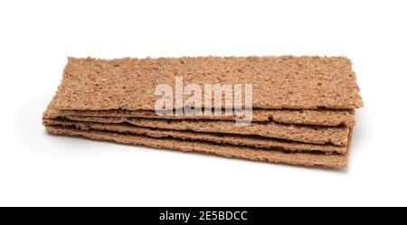 Stack of thin rye crispbread isolated on white. Side view. Stock Photo