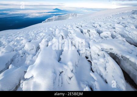 Magic breathtaking  view to Snows of Kilimanjaro volcano and glaciers with Mount Meru 4562m silhouette. 5895m - the highest point of Africa and the hi Stock Photo