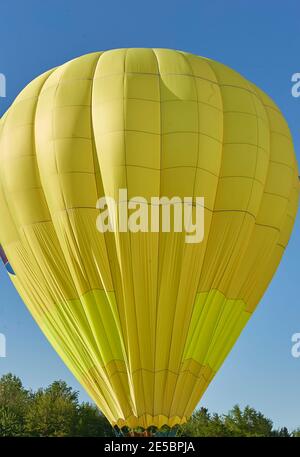 Hot Air balloon lifting off Stock Photo