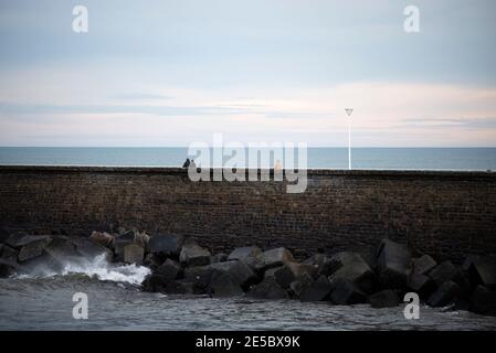 walk above the breakwater in san sebastian Stock Photo