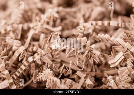 Brown shredded paper, strips of sliced corrugated eco paper for packing  Stock Photo - Alamy