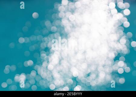 View of blurry surface of turquoise water with glare in swimming pool, sea, lake, or ocean, summer mood background. Concept rest, travel, wellness, sp Stock Photo