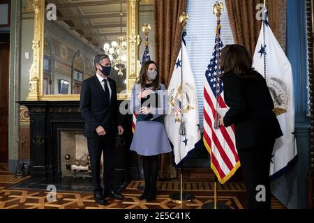 Washington, United States. 27th Jan, 2021. U.S. Vice President Kamala Harris, right, speaks to Antony Blinken, U.S. secretary of state, left, and his wife Evan Ryan during a swearing in ceremony at the White House in Washington, DC on Wednesday, January 27, 2021. The Senate yesterday confirmed Blinken, giving one of President Biden's longest-serving aides the task of resuming nuclear negotiations with Iran and restoring trust with allies shaken by four years of the Trump administration. Photo by Stefani Reynolds/UPI Credit: UPI/Alamy Live News Stock Photo