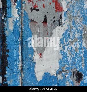 AA weathered and partly eroded section of blue painted wall Stock Photo