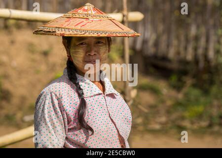 Portrait of young woman looking at camera in small village near Stock Photo