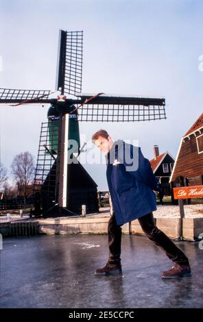 ZAANSE SCHANS, THE NETHERLANDS, DEC 19, 1997: Actor Casper van Dien on ice in the Netherlands in front of a mill during a promotion tour of the movie Stock Photo