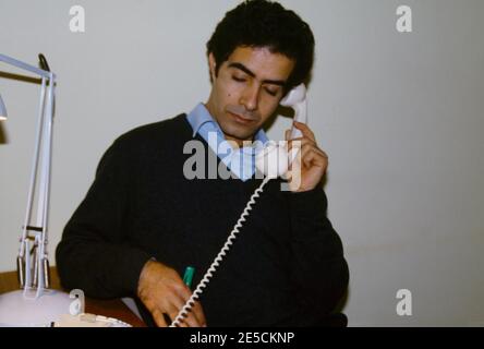 Egyptian Man using Telephone Stock Photo