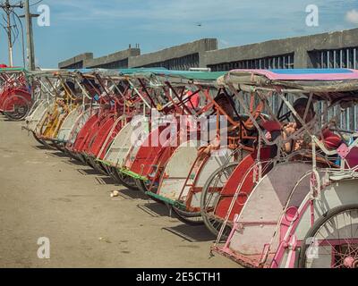 Ambon, Indonesia - Feb, 2018: Becaks, the traditional transportation in Indonesia. (Beca, Betjak, Betja, or Beetja). It is the Indonesian incarnation Stock Photo