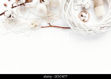 feminine workspace with laptop, christmas decoration, bow on white background. flat lay, top view Stock Photo