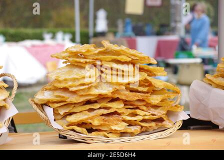 Pile of oreillettes, Provencal donut in a market Stock Photo