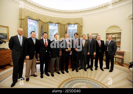 U.S. President George W. Bush (C) holds the 2008 Ryder Cup trophy as he poses with members of the golf team during a photo op in the Oval Office in Washington, DC, USA on November 17, 2008. (L-R) Stewart Cink, Chad Campbell, Ben Curtis, Hunter Mahon, President Bush, Team Captain Paul Azinger, Raymond Floyd, Jim Furyk, J.B. Holmes and Boo Weekley.(Pictured:Stewart Cink, Chad Campbell, Ben Curtis, Hunter Mahon, George W. Bush, Paul Azinger, Raymond Floyd, Jim Furyk, J.B. Holmes , Boo Weekley). Photo by Olivier Douliery/Cameleon/ABACAPRESS.COM Stock Photo