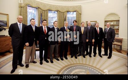 U.S. President George W. Bush (C) holds the 2008 Ryder Cup trophy as he poses with members of the golf team during a photo op in the Oval Office in Washington, DC, USA on November 17, 2008. (L-R) Stewart Cink, Chad Campbell, Ben Curtis, Hunter Mahon, President Bush, Team Captain Paul Azinger, Raymond Floyd, Jim Furyk, J.B. Holmes and Boo Weekley.(Pictured:Stewart Cink, Chad Campbell, Ben Curtis, Hunter Mahon, George W. Bush, Paul Azinger, Raymond Floyd, Jim Furyk, J.B. Holmes , Boo Weekley). Photo by Olivier Douliery/Cameleon/ABACAPRESS.COM Stock Photo