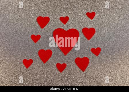 Red Hearts Cluster On Silver Abstract Background Design Stock Photo
