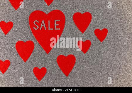 Red Hearts On Sale With Silver Background Stock Photo
