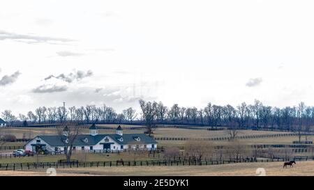 Barns and pastures of a horse farm in Lexington, Kentucky in the winter Stock Photo