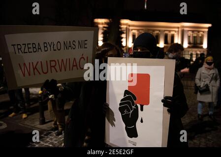 Warsaw, Warsaw, Poland. 27th Jan, 2021. Demonstrators hold placards in front of the Constitutional Tribunal building on January 27, 2021 in Warsaw, Poland. Hundreds of people took to the streets after the constitutional tribunal published the ruling that makes abortion in case of severe faetus malformation illegal. Credit: Aleksander Kalka/ZUMA Wire/Alamy Live News Stock Photo