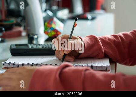 Schoolwork being done at home Stock Photo