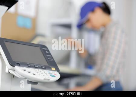 woman calibrating printer while working in nice printing office Stock Photo