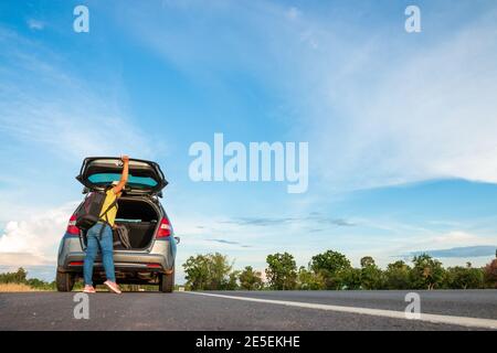 Women tourists With her travels On the road while traveling Stock Photo