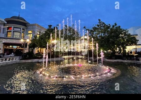 A water fountain and pond at  The Grove shopping center, Wednesday, Jan. 27, 2021, in Los Angeles. Stock Photo