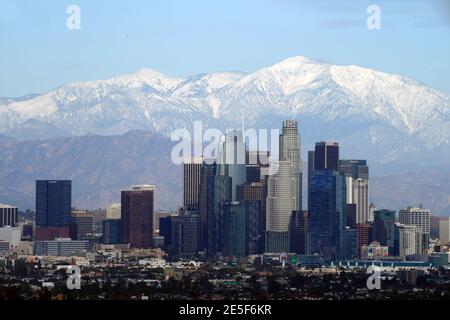 A general view of the downtown Los Angeles skyline with the snow-capped San Gabriel Mountains as a backdrop on Wednesday, Jan. 27, 2021. Stock Photo