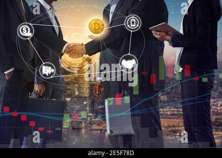 Bitcoin (BTC) and cryptocurrency payment acceptance concept - Businessman handshaking showing accepted payment by using Bitcoin. Blockchain and Stock Photo