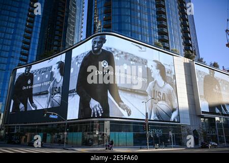 Sabrina Ionescu and Kobe Bryant appear in a Nike ad during near a memorial for Kobe Bryant and daughter Gianna near Staples Center, Tuesday, Jan. 26, Stock Photo