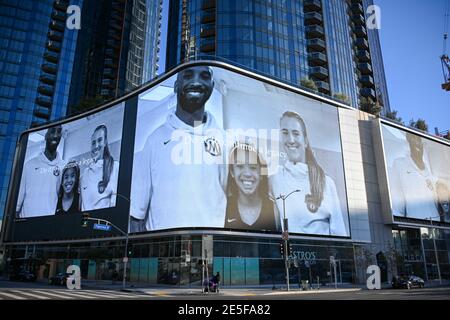 Sabrina Ionescu (right), Gianna Bryant (center) and Kobe Bryant appear in a Nike ad during near a memorial for Kobe Bryant and daughter Gianna near St Stock Photo