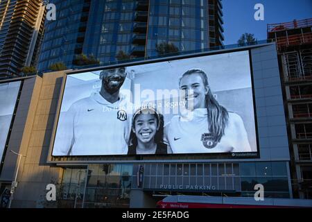 Sabrina Ionescu (right), Gianna Bryant (center) and Kobe Bryant appear in a Nike ad during near a memorial for Kobe Bryant and daughter Gianna near St Stock Photo